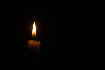 Candle flame in black background