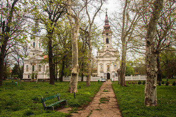 Fototapeta na wymiar Church in a park in center of small town. Alibunar in Serbia.
