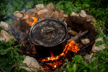Close shot of a pan on campfire
