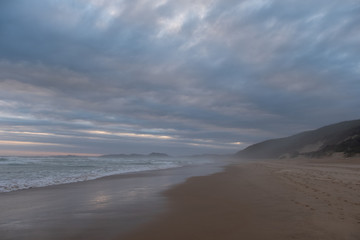 The sandy beach at Brenton on Sea, photographed at dusk. Knysna, South Africa.