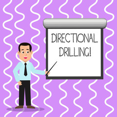 Conceptual hand writing showing Directional Drilling. Concept meaning drilling for oil which the well not drilled vertically Man in Necktie Holding Stick Pointing White Screen on Wall