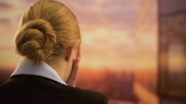 Businesswoman crying in despair, failed startup, bankruptcy and debts concept