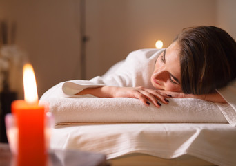 Obraz na płótnie Canvas Girl on massage in the spa salon