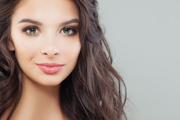Attractive female face closeup. Perfect brunette model portrait