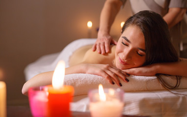 Fototapeta na wymiar Girl on massage in the spa salon.