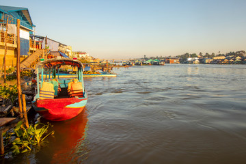 Fototapeta na wymiar Boats and houses of Chau Doc in Vietnam