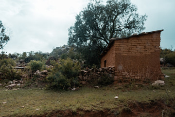 Small and old house in the countryside, built with mud, straw in Bolivia.