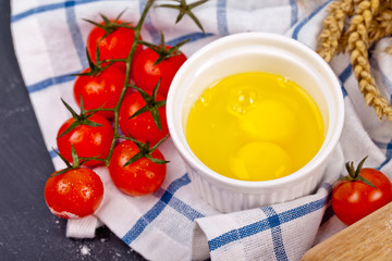 Baking background with eggshell, flour and rolling pin. Pizza cooking ingredients. Selective focus.