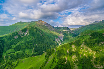 Obraz premium Panorama of mountains and gorge, overgrown with dense forest