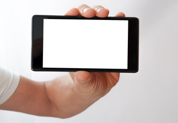 black phone in hand with white screen on white background