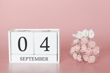 September 04th. Day 4 of month. Calendar cube on modern pink background, concept of bussines and an importent event.