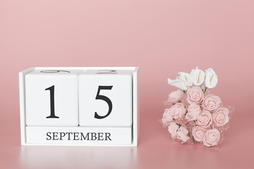 September 15th. Day 15 of month. Calendar cube on modern pink background, concept of bussines and an importent event.