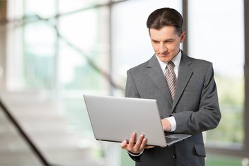 Businessman hiding dollars banknotes in the pocket of jacket