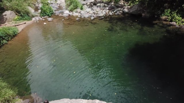 AERIAL: angled down watching the ripples created by Mango Waterfall in Adjuntas, Puerto Rico.