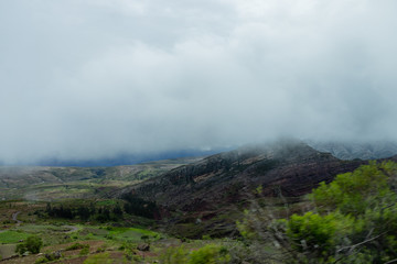 Landscape in Bolivia formed by mountains and white clouds