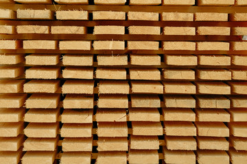 Stacked wooden boards. Building materials