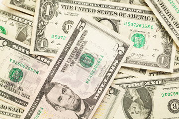 Fototapeta na wymiar US dollar money cash background. Heap of one and five dollars