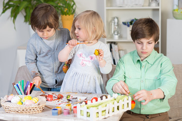 Preparations for Easter celebration with painting eggs and entertaining with family