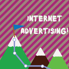 Text sign showing Internet Advertising. Business photo text uses the Internet to deliver promotional marketing Three Mountains with Hiking Trail and White Snowy Top with Flag on One Peak