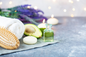 Spa, beauty treatment and wellness background Towel Cosmetic Massage oil, flowers, lights and candel