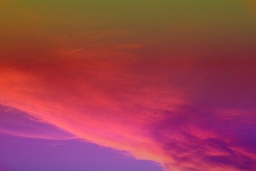 Fototapeta premium beautiful vivid sun colored partially cloudy sky for using in design as background.