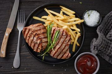 grilled steak and fried potatoes