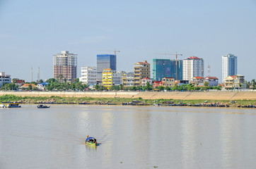 View from the Preah Sisowath Quay over the Tonle Sap River at the newly erected district in Phnom...
