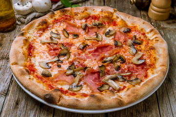 Pizza with ham and mushrooms