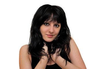 Naklejka premium Young brunette girl on a white background. Shoulder portrait.