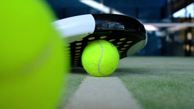 Paddle tennis and rackets, them a hand take balls and go to play