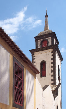 the tower of São Pedro church in funchal a historic 17th century building in madeira notable for the colored tiles on the spire