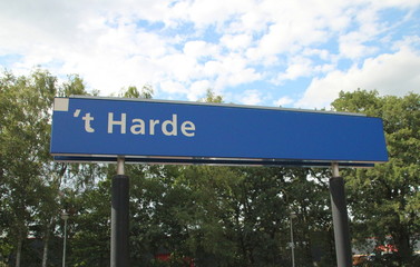 Fototapeta premium Name sign at the train station 't Harde close to Zwolle in the Netherlands