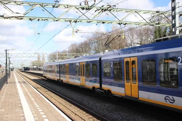 Foto op Aluminium CAF Civity train at the trainstation of Den Haag Laan van NOI in the Netherlands © André Muller