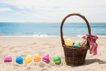 Beach Happy Easter background with basket and color eggs - 262348742