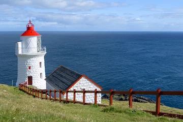 Zelfklevend Fotobehang The lighthouse in Nolsoy island, Faroe Islands © Dimitrios