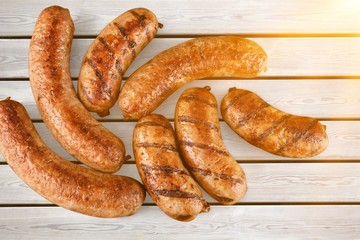 Roasted sausages on white background