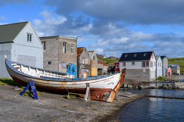 Fototapeta na wymiar Fishing boats in Nolsoy village, Faroe Islands