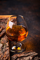 Glass of cognac or whiskey.