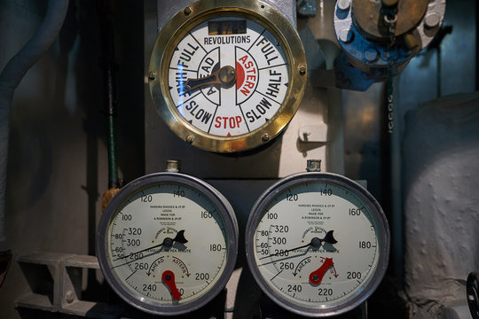 Engine Order Telegraph And Two Manometers To Comunicate Movement Of Ship From Captain Bridge In Boiler Room Of Steam Powered War Ship Or Batte Ship From World War Two Served In Royal British Navy