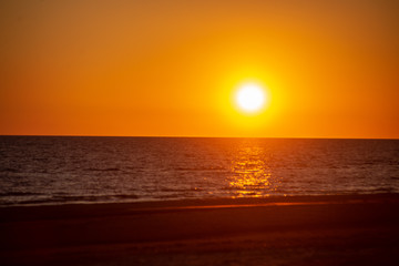 dark red sunset over sea in evening