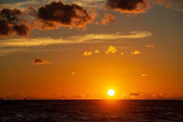 dark red sunset over sea in evening