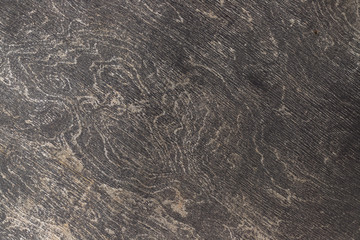 Black plywood flooring. Paint erased with time. Wood texture.