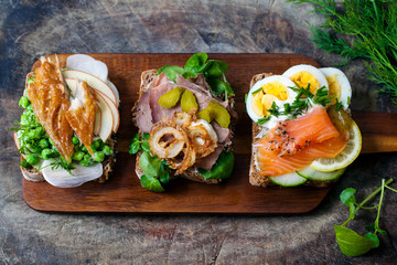 Scandinavian open sandwiches: beef, watercress and crisp onion, egg and salmon, smocked mackerel with crushed peas, fennel and apple