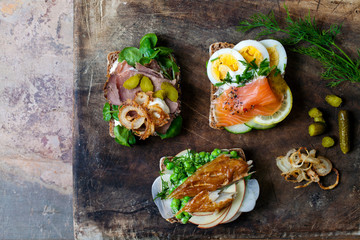 Scandinavian open sandwiches: beef, watercress and crisp onion, egg and salmon, smocked mackerel...