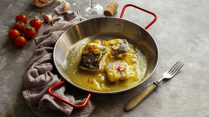 bacalao al pil pil, salted cod in emulsified olive oil sauce, spanish cuisine, basque country