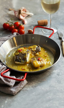 bacalao al pil pil, salted cod in emulsified olive oil sauce, spanish cuisine, basque country