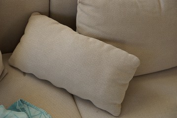  brown fabric pillows on the couch in the room