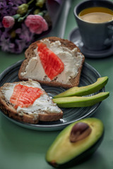 Launch with Dietary sandwiches with grain bread, cream cheese and avocado