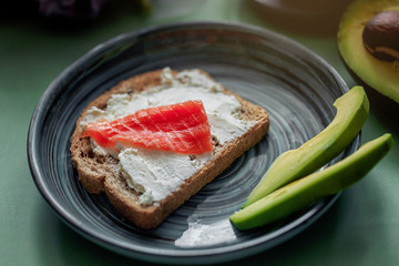 Launch with Dietary sandwiches with grain bread, cream cheese and avocado