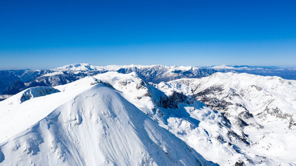 Fototapeta na wymiar Aerial view of a mountains peak from a drone
